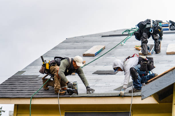 Professional Gutter Installation technician working in Gilbertville, MA